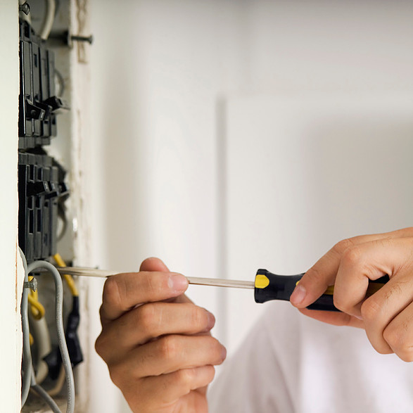 Alpha Electric Group technician completing commercial electrical panel wiring and inspection in Suttons Bay, MI.